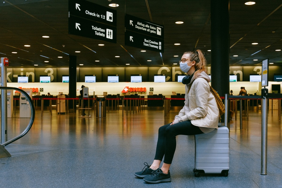 Woman At Airport With Mask